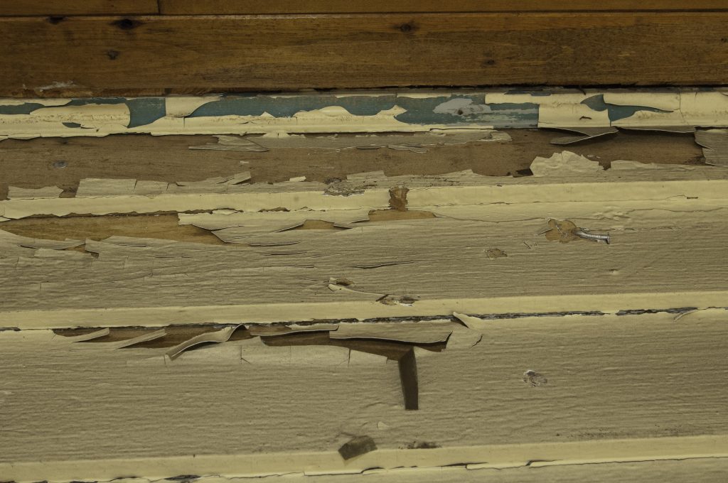 Peeling paint on clapboard