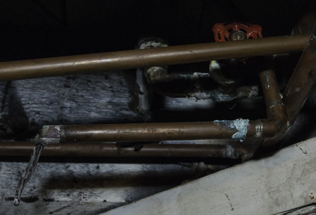 Broken and corroded copper pipe