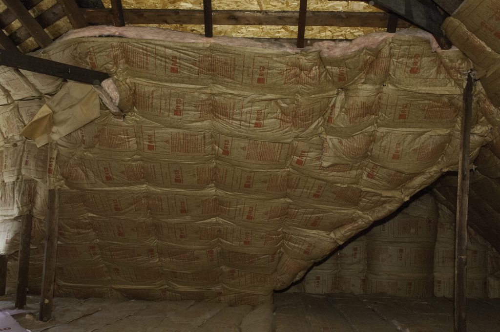 Attic insulation across trusses